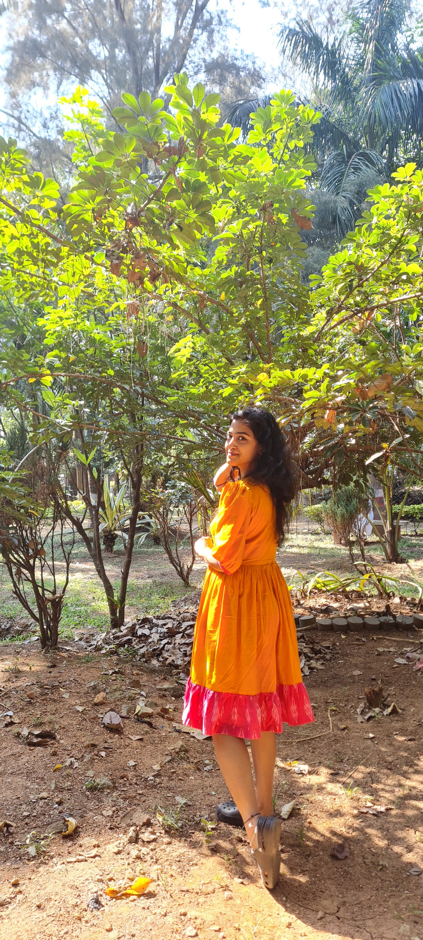 Radiant Elegance: The Orange Cotton Frock with Ikat Frills