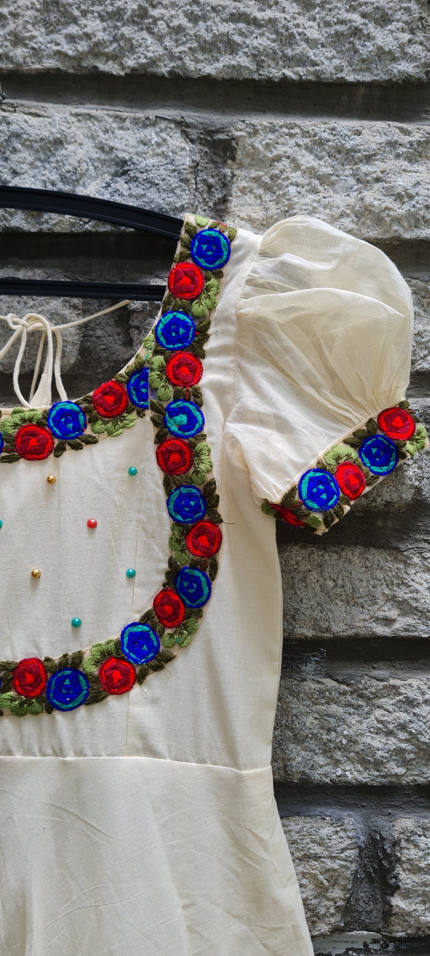 Onam Opulence: Off-White Umbrella Cut Frock with Red and Blue Embroidery