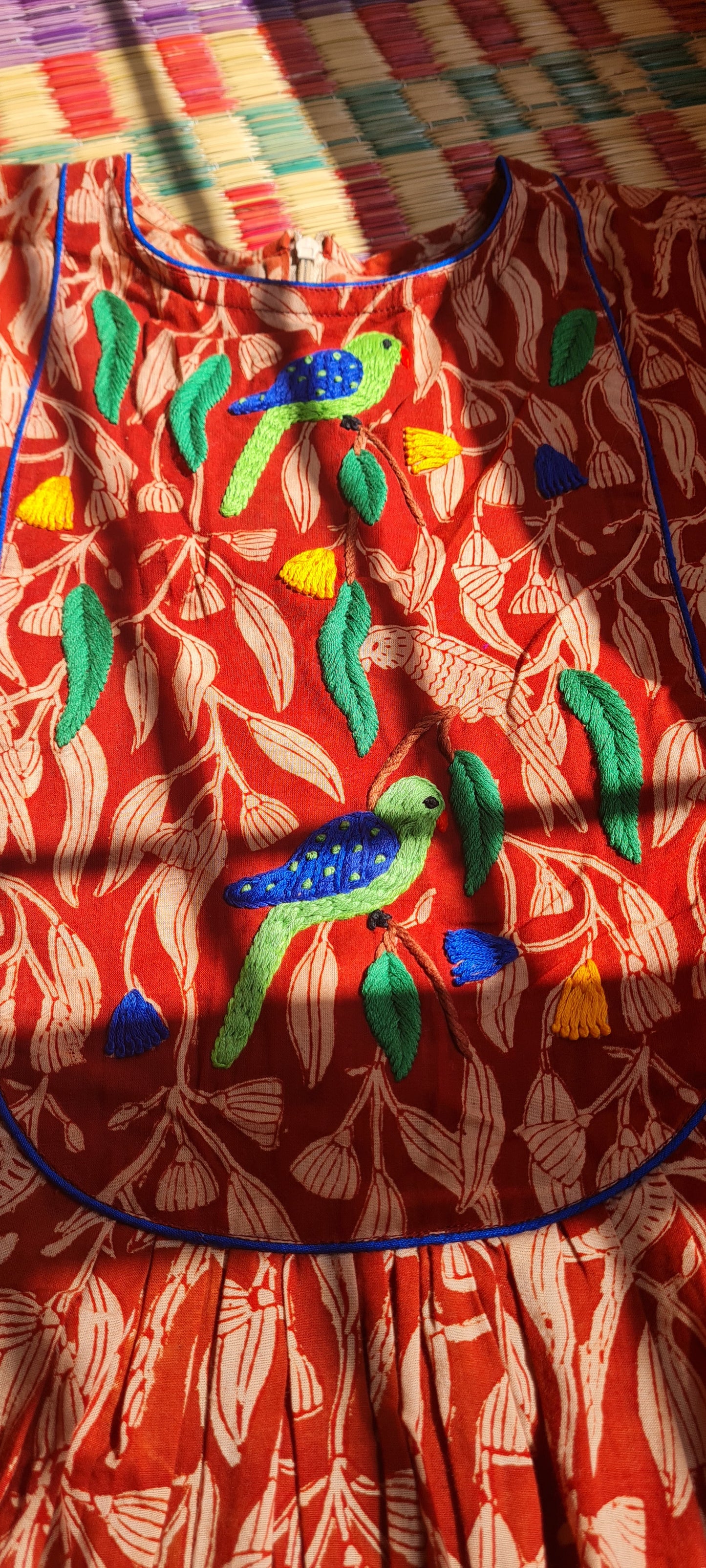 Whispers of Elegance: A Parrot-Inspired Tapestry Frock