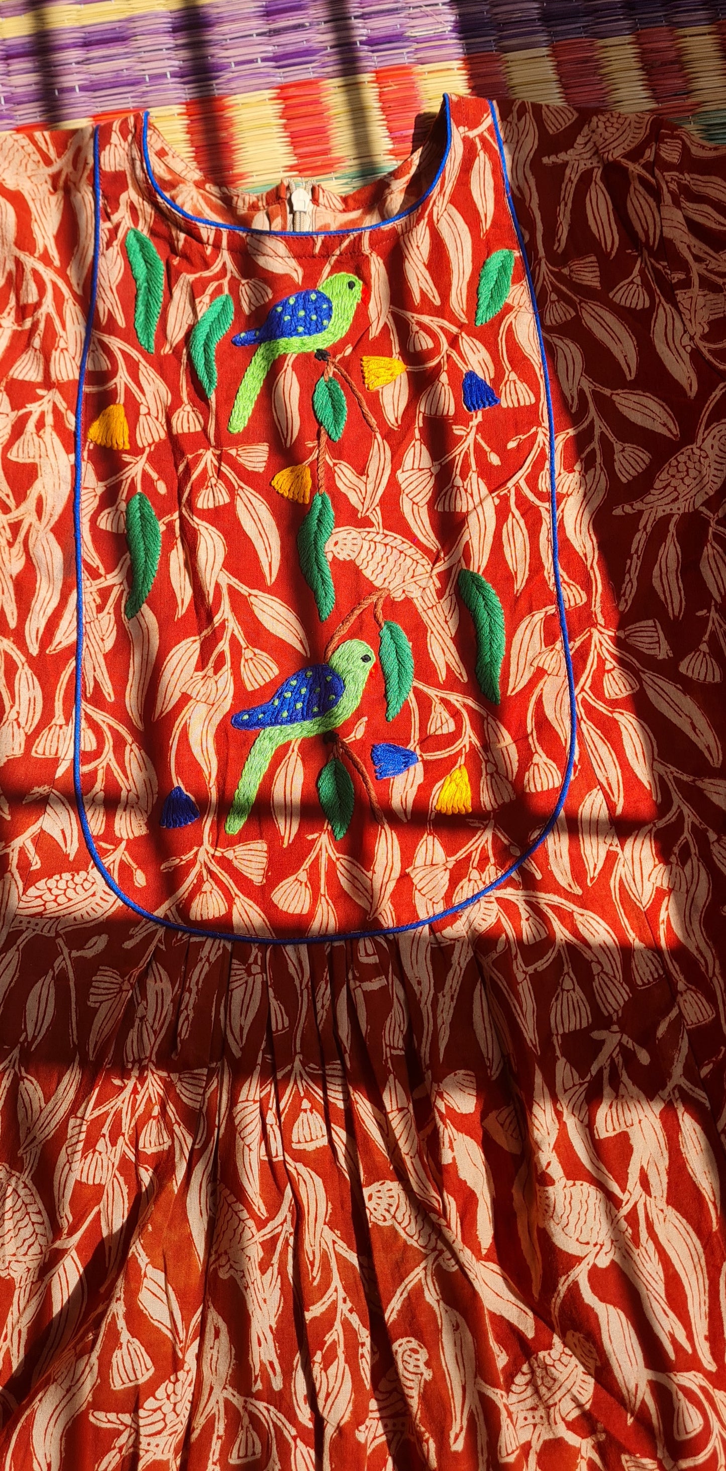 Whispers of Elegance: A Parrot-Inspired Tapestry Frock