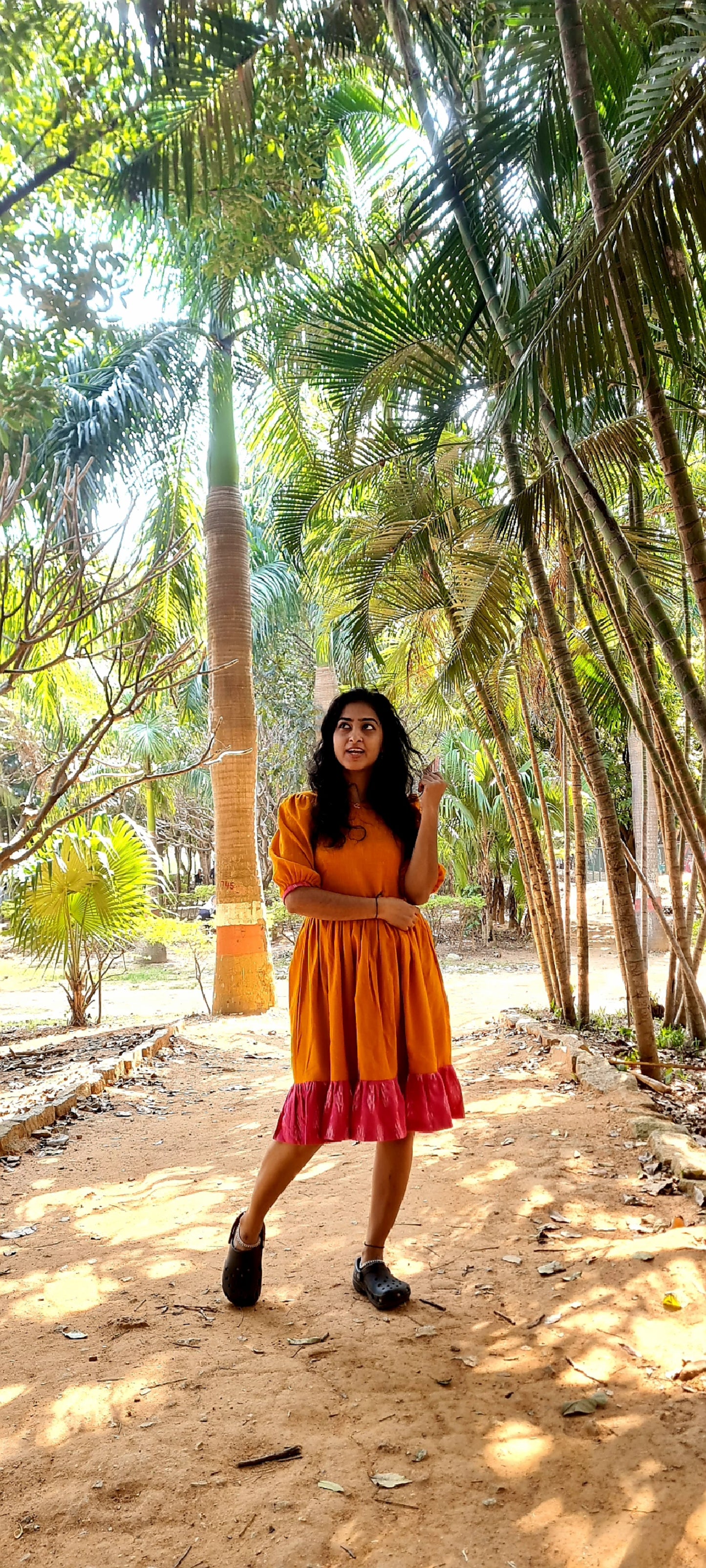 Radiant Elegance: The Orange Cotton Frock with Ikat Frills