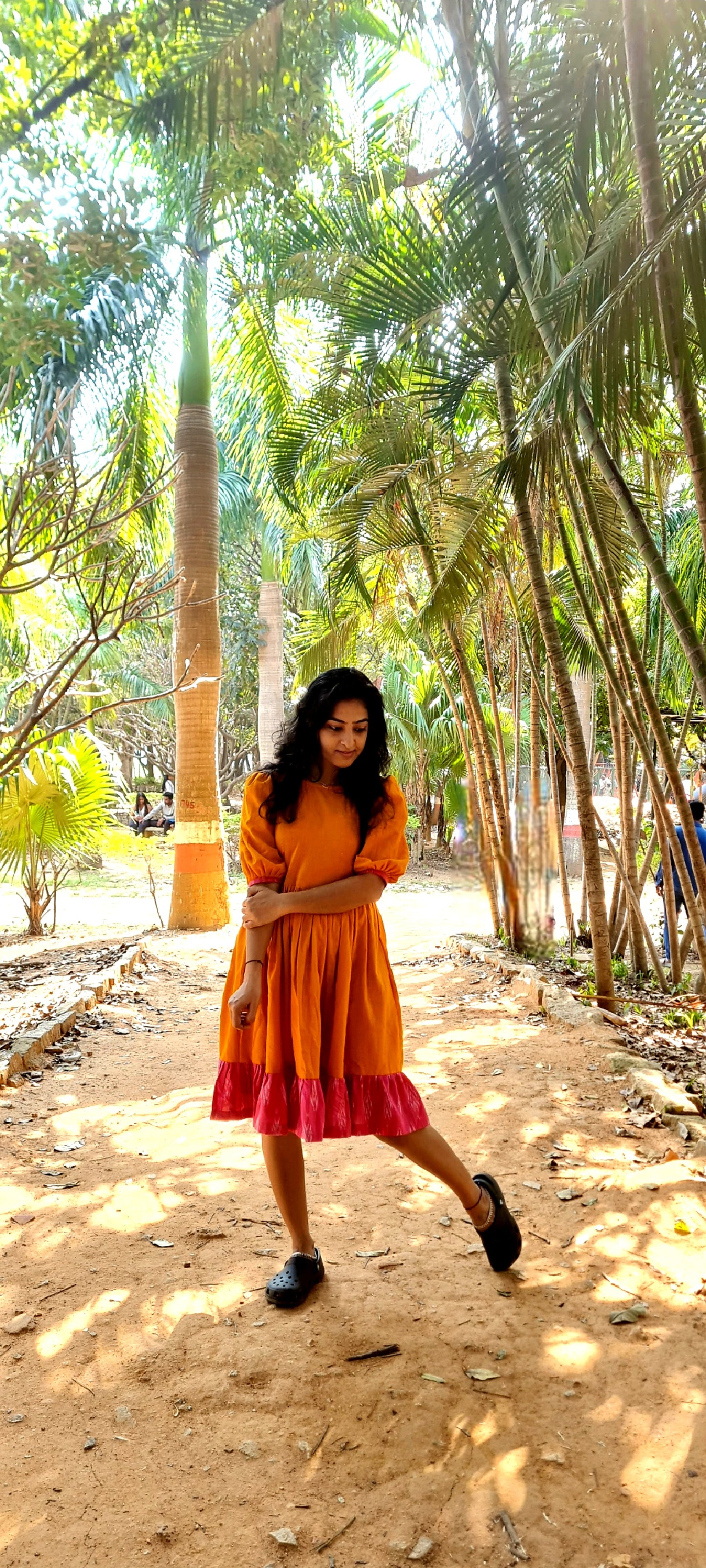 Radiant Elegance: The Orange Cotton Frock with Ikat Frills
