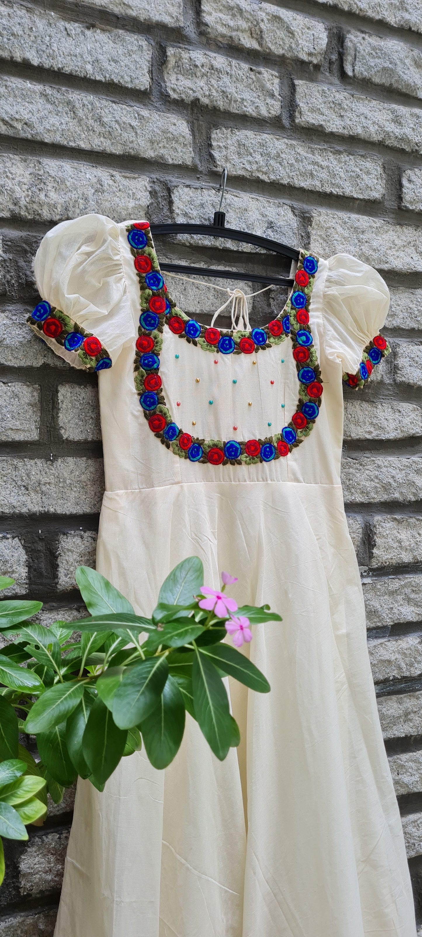 Onam Opulence: Off-White Umbrella Cut Frock with Red and Blue Embroidery